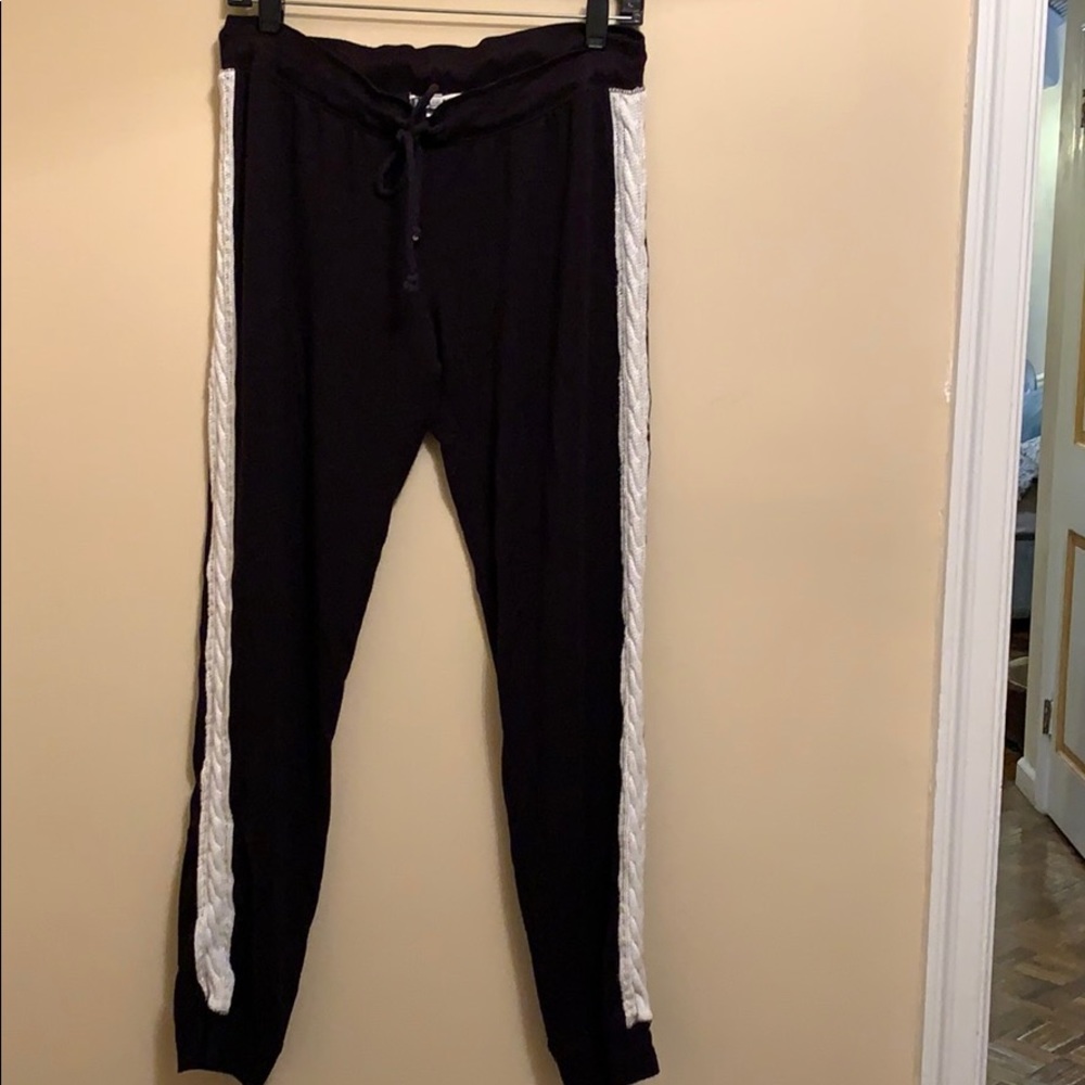 Black PJ Salvage lounge pants with white track stripe.